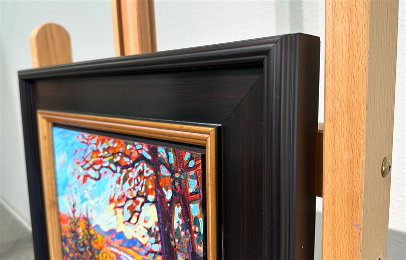 A petite canvas captures the wide landscape and vivid fall colors of the Blue Ridge Mountains in North Carolina. Blue Ridge Parkway is the most-traveled highway in the U.S., as leaf peepers from far and wide gather to see the brilliant fall foliage.</p><p>"Blue Ridge Vista" is an original oil painting on linen board. The piece arrives framed in a classic black and gold plein air frame, ready to hang.