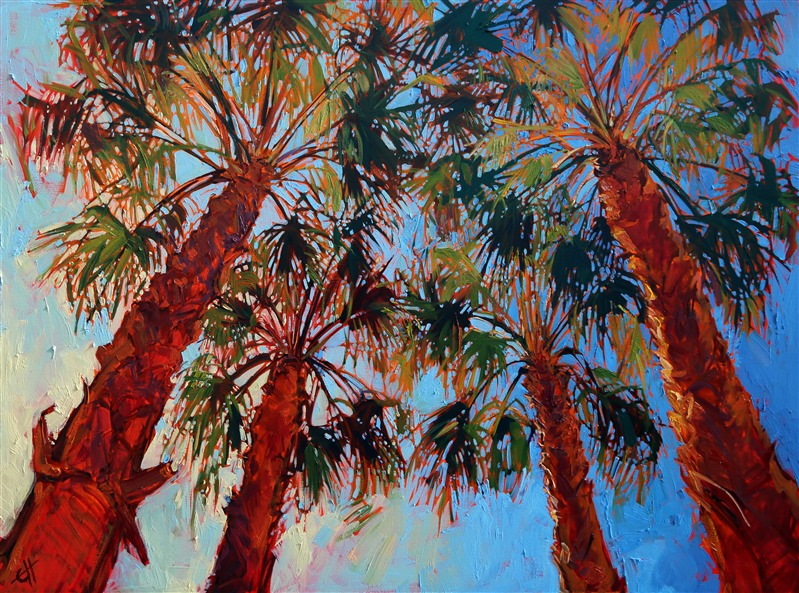 Looking up into these palm trees, the spiky green leaves seemed to filter the sunlight into a myriad of rainbow colors. The sky forms a mosaic pattern behind the palms.