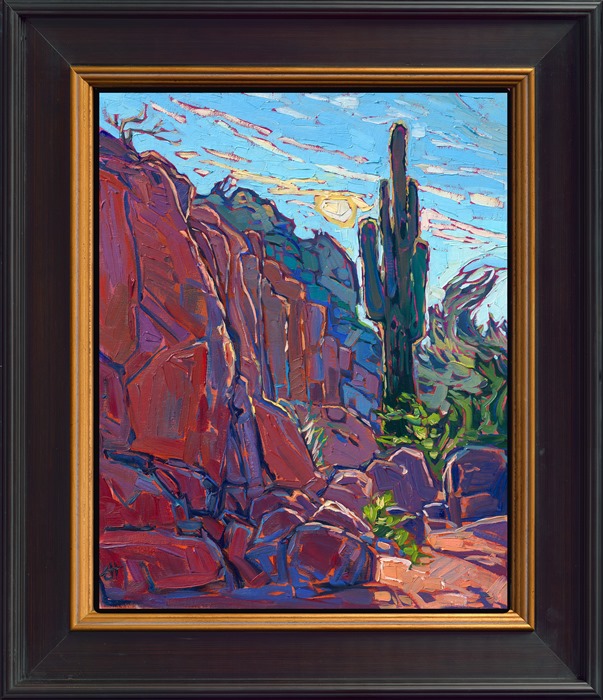 A saguaro cactus on Camelback Mountain near Scottsdale, Arizona, is captured in thick, expressive brush strokes and impressionistic color. The red rock boulders turn hues of purple and blue in the shadows.</p><p>"Saguaro Boulders" is an original oil painting on linen board. The piece arrives framed in a black and gold plein air frame, ready to hang.<br/>
